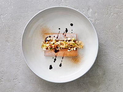 Herring with liquorice and crispy pork popcorn