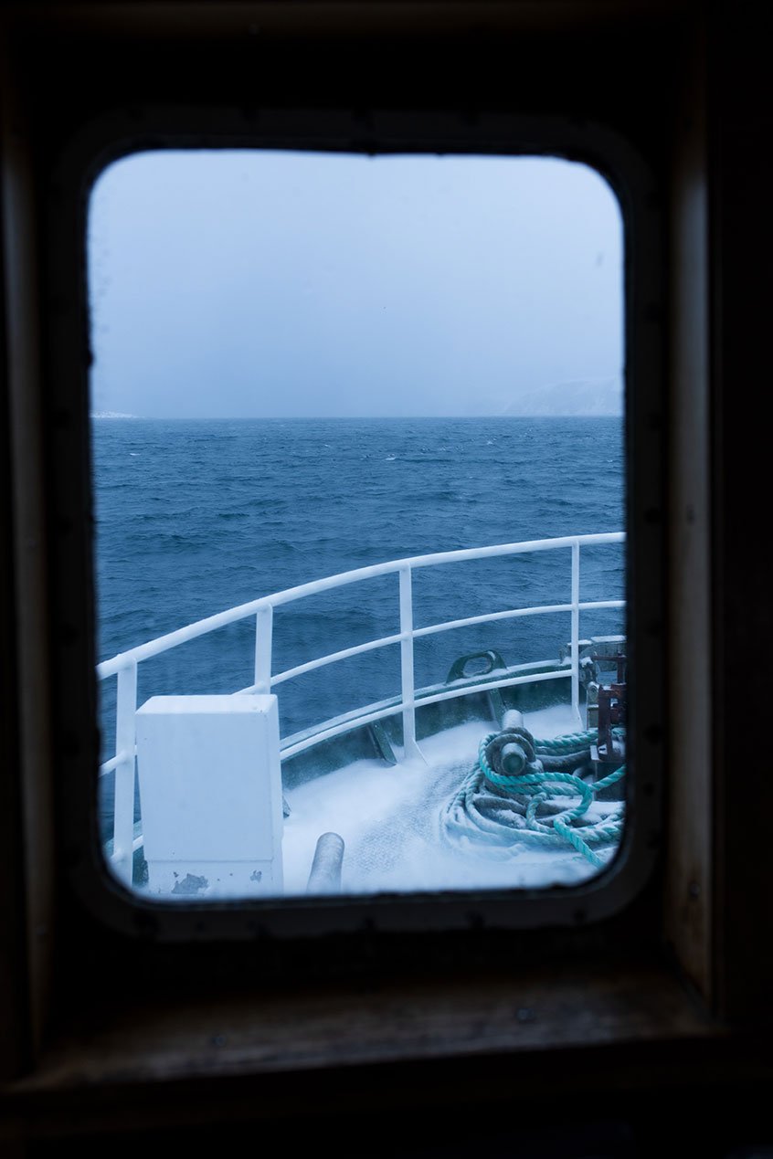 Looking out of a window on the boat